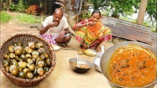 'how santali tribe people clean KING SNAIL and cooking for their lunch menu || rural village India'