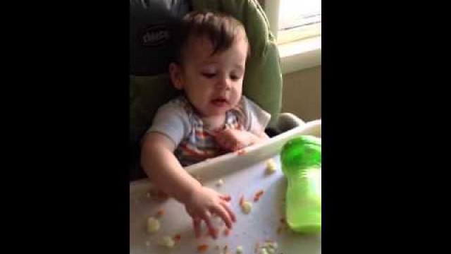 'Hudson 11 months shoveling food in'