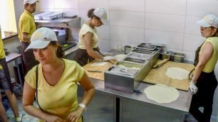 'Preparing and Frying Chebureki, Meat Filled and Deep-Fried Dough. Kiev Street Food, Ukraine'