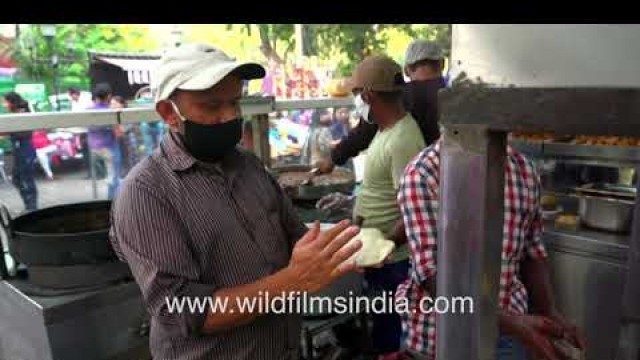 'Flattening and tossing bhature in giant frying pan - Delhi street food in slow motion'