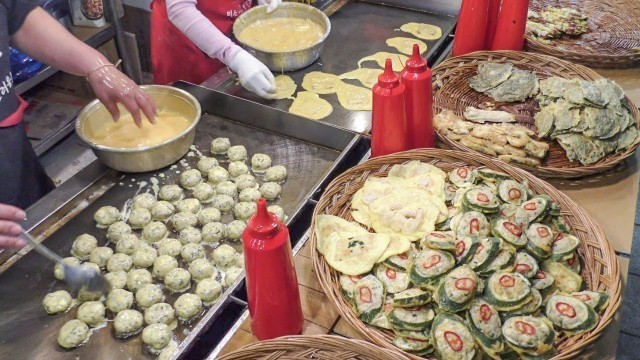 'Korea Street Food. Cooking and Frying Pancakes on the Street. Hongdae, Seoul'