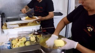 'Italy Street Food. Cutting and Frying \'Frittelle di Mele\',  Apple Fried Pancakes'