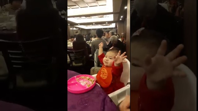 'Happy 11 months old baby enjoying Chinese New Year. Baby loves food. Please give me red envelopes.'