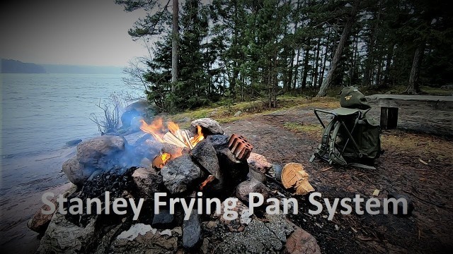 'Cooking food over a campfire with Stanley Frying Pan System'