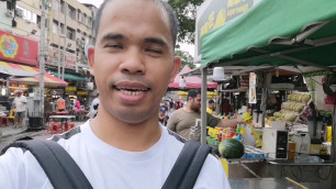 'Eating Street Foods in Jalan Alor Night Food Market, Kuala Lumpur, Malaysia'