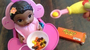 'Baby Alive Super Snackin\' Lily Doll eats Reese\'s Pieces Candy for a Snack!'